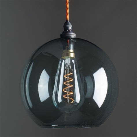 Globe pendant lighting allows you to dazzle with your home's lighting decor using a universal form that captures the gaze and brings. Lenham Smoked Grey Glass Globe Pendant Light in 2020 ...