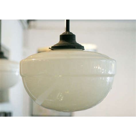 The chain links can be removed to shorten the fixture. Schoolhouse Brass Pendant Light with Globe | Chairish