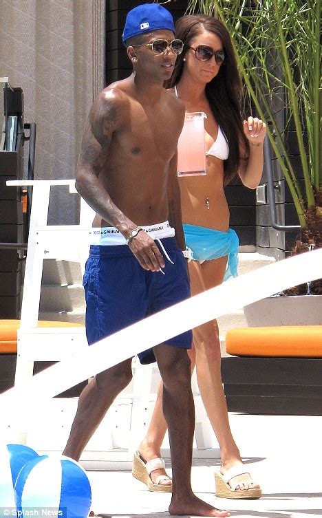 What an interesting dress she is wearing though! Aston Villa's Ashley Young takes his mind off his ...