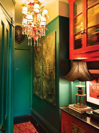 Emerald green decor — the fox & she. Emerald-green and coral paint give the entryway a moody ...