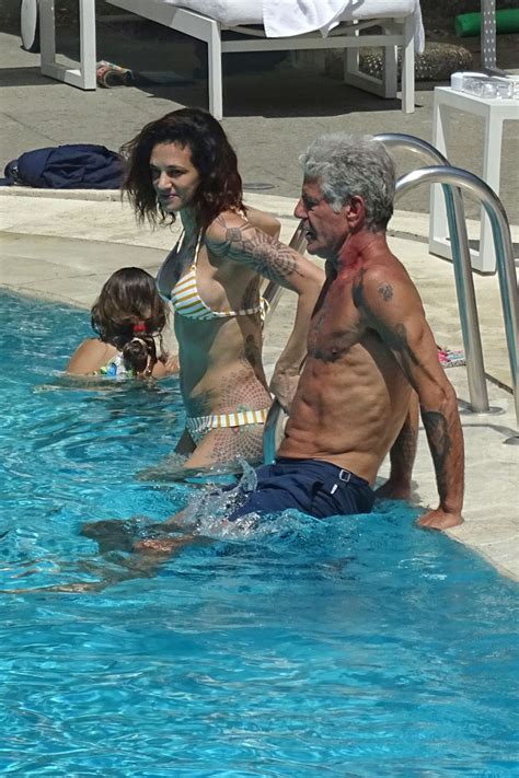 (photo by neilson barnard/getty images). ASIA ARGENTO in Bikini and Anthony Bourdain at a Pool in ...