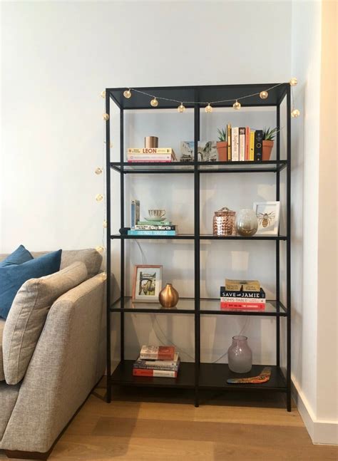 A minimalist shelf, without legs and barely visible brackets beneath. IKEA VITTSJO | Glass Shelving Unit | Industrial Style ...