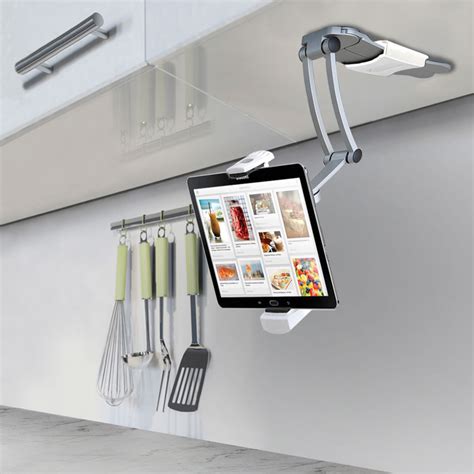 Mounts underneath, on front or on side of cabinet. The Under-Cabinet iPad Dock - Hammacher Schlemmer