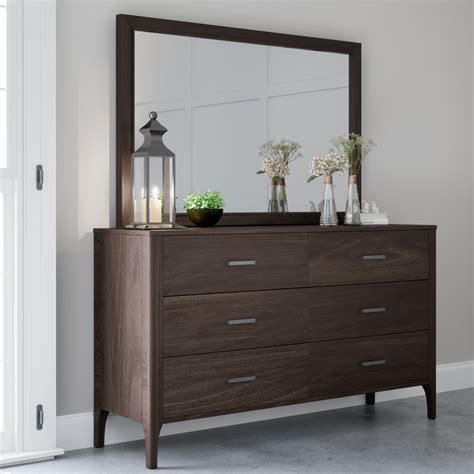Because the slides are made of metal, each drawer can hold up to 25 pounds. Devon & Claire Carrington Wood 6 Drawer Dresser & Mirror ...