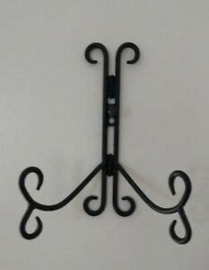 The open, breathable shelving gives plants plenty of room to stretch out and wrought iron is a perfect accompaniment to any type of decor. BLACK WROUGHT IRON PLATE STAND ART HOLDER EASEL TABLE OR ...