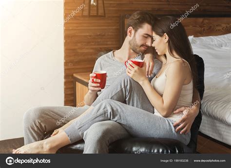 Happy loving couple in bedroom in the morning — Stock Photo © Milkos #199183238