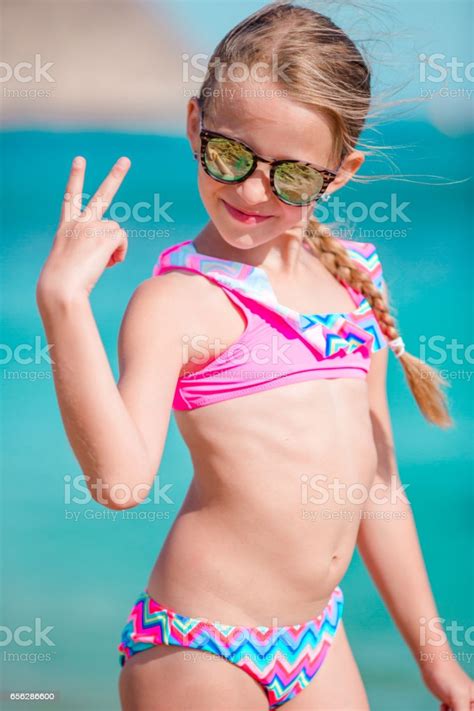 I never see any girls with glasses on this sub! Adorable Smiling Little Girl On Beach Vacation Stock Photo ...