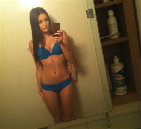 Skinny and tattoed emo girlfriend selfshot. Super cute brunette looking great in her blue bikini ...