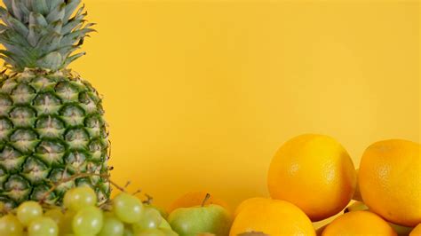 Changing your zoom background gives regular video conference meetings some visual flair. Organic and natural mix of fruits on yellow background ...