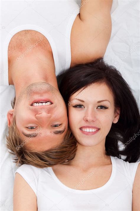 Cute couples in love kissing cuddling and hugging 2015 (106). Young lovely couple lying in a bed — Stock Photo © mast3r ...