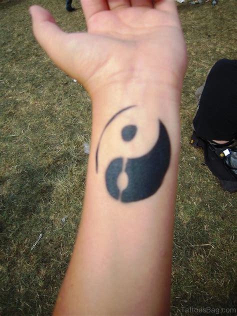 The bright colors are the best part of this amazing design. 39 Perfect Yin Yang Tattoos On Wrist