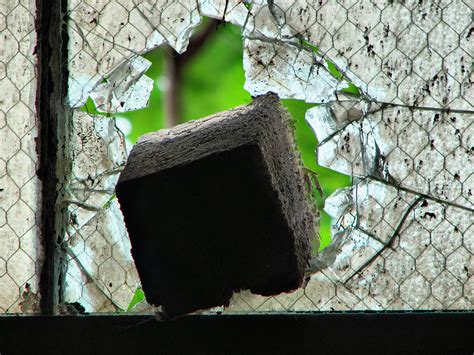 You must be logged in to comment. broken | brick stuck in the second floor window of the ...