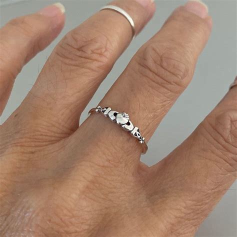 When you wear a claddagh on your left ring finger, it's a sign that you've found the one you'll be spending the rest of your life with. Sterling Silver Tiny Irish Claddagh Ring Dainty Ring ...