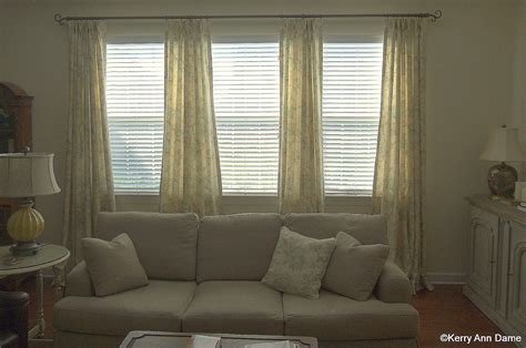 Choosing and finding the right window treatments for tall windows can be. Soft printed line panels on a triple window | Living room ...