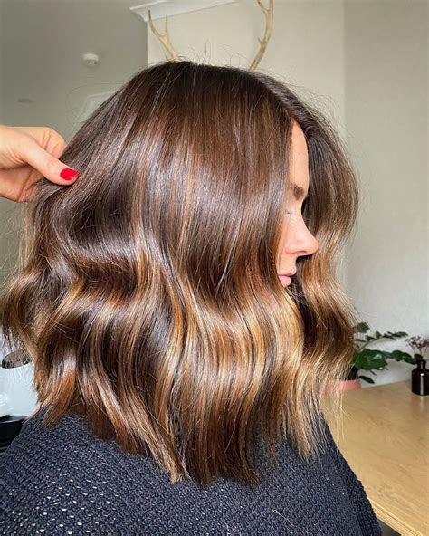 Blonde highlights on a caramel brown hair result to a natural yet appealing look that can turn eyes on almost all occasions. Golden Brown with Caramel Highlights#brown #caramel # ...