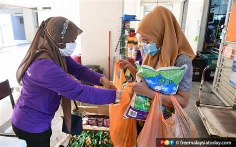 Relatives of migrant workers who are jailed in malaysia, in nizamabad. Give us safe passage to feed migrant workers, say ...