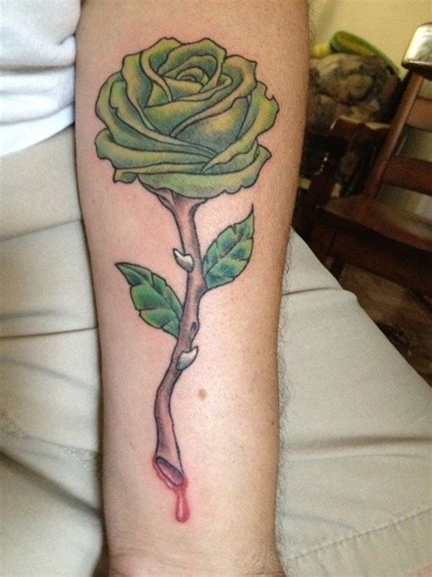 It is also the memorial tattoo for departed beloved spouse. Meaning of Rose Tattoo - Black, Blue, Purple, and Other ...