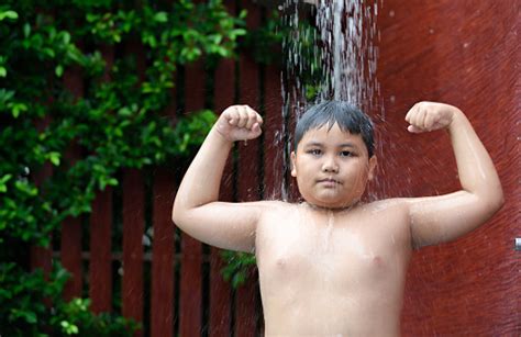 Fat boy in his first cloak! Obese Fat Boy Show Muscle And Taking Shower Stock Photo ...