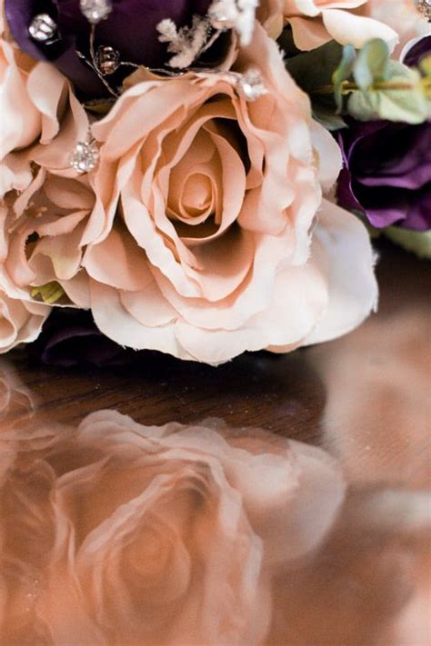 A bridal bouquet on a purple wedding doesn't necessarily have to be monotone. I love champagne colored roses!! | Rose, Rose gold color ...