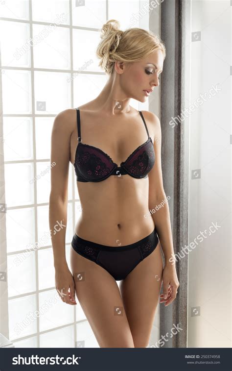 A newer method of stretching natural hair is using a straightening brush. Beautiful Blonde Woman Stunning Body Posing Stock Photo ...
