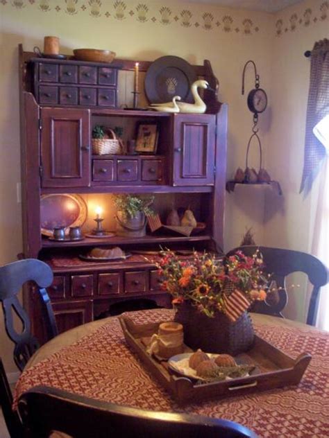 It is a dark finish,counter height table w/ ladder back chairs & a buffet & hutch. A Primitive Place ~ Primitive & Colonial Inspired Dining Rooms