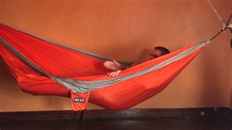 Ever wonder how this hammock camping thing works? How to sleep in an indoor hammock - YouTube