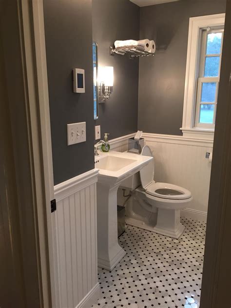 Grey takes over the half part of the walls of this bathroom with a vanity in deeper gray finish as the main focal point complements it beautifully. 25 Beautiful Gray Bathrooms