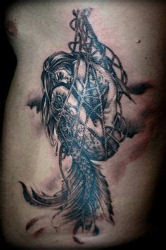 Try these temporary tattoos for a super easy mermaid look. Mermaid in Net Tattoo - Design of TattoosDesign of Tattoos