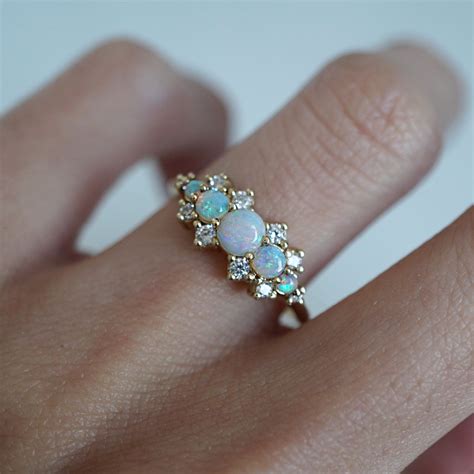 The elegant aqua blue hue of the gemstone beautifully blends with the brilliance of the diamonds. 14K Australian Opal Heaven Ring | Pink morganite engagement ring, Aquamarine engagement ring ...