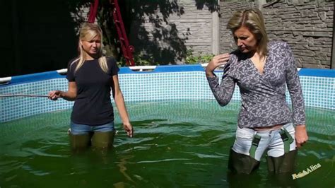 Girls in waders and jeans | gummistiefel, stiefel, reitstiefel. 2 Girls in Waders and Jeans: 2 Girls in Waders and Jeans in an outdoor pool - UMD