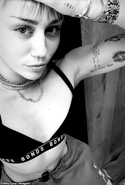 On her right hand alone she has 9 tattoos, though they are all tiny. Miley Cyrus looks unusually elegant as she covers up her tattoos with Cody for dinner | Daily ...