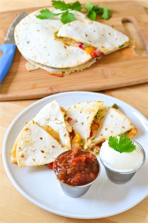 This chicken quesadilla recipe stuffed with monterey jack and cheddar cheese is just the appetizer for a cinco de mayo party or any celebration coming up. Chicken Quesadillas Recipe - Courtney's Sweets
