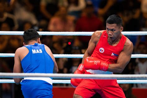 31, 2018, file photo, phillippines' eumir felix marcial, left, and uzbekistan's israil madrimov fight in their men's middleweight boxing semifinal at the 18th asian. Filipino boxer Marcial to turn pro but still compete at ...