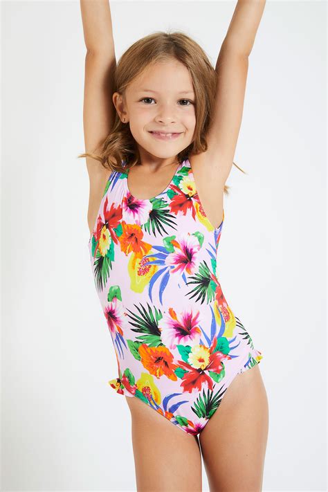 Interi o bikini, tutti i modelli da indossare in riva al mare. Costume da bagno intero tropicale rosa per bambine ...