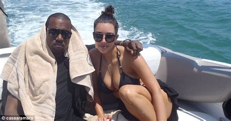 Kanye West grins while zip-lining with Kim Kardashian as ...