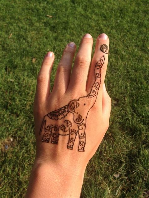 Classic four henna tattoo design for wrist. Henna elephant. 🐘💙 | Hand tattoos, Henna elephant, Hand henna