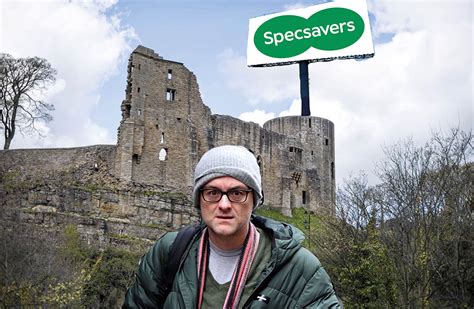 The sign on the wall in the town reads: Cummings poached from Downing Street by Specsavers to work ...