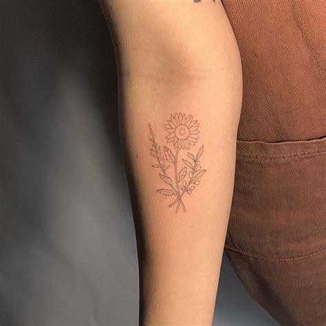 Flower tattoos are one of the most popular tattoo designs on the planet. Sunflower olive branch goosefoot bouquet @courtneykyer #sanfranciscotattoo#losangelestattoo# ...