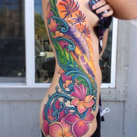 Not all artists are adept at all styles. Female, full colour rib (side) tattoo.