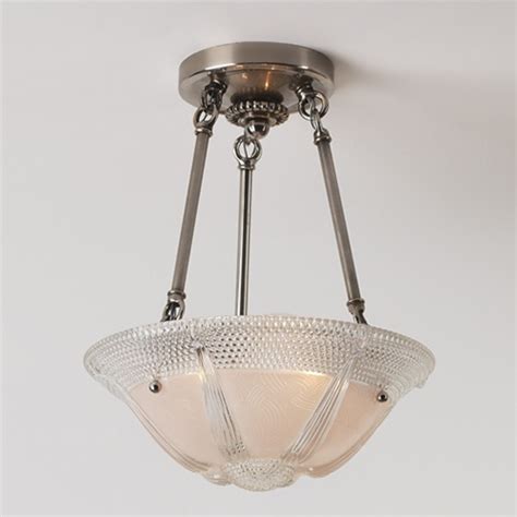 You can see from the top view of the cage light cover that the screws and washers make it adjustable. Honeycomb | Vintage Ceiling Light