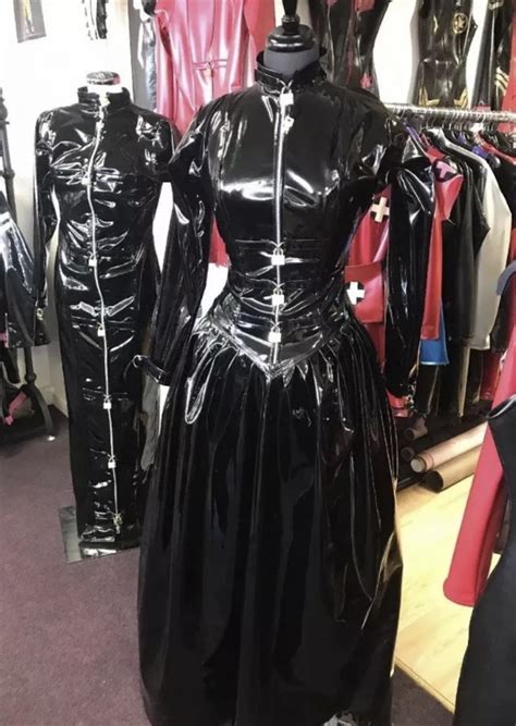 This latex dress looks stunning on various body types, from thin to curvy. PVC PADLOCK STRAITJACKET BALLGOWN