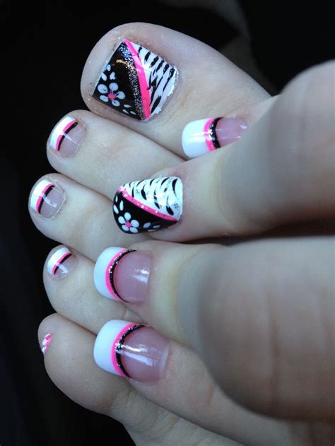 Incorporating various colors together are always these flower toes have a similar aesthetic to what you get from a french manicure, but with a twist by using black instead of white and giving the tips an. Pink black and white flower zebra toe nail design ...
