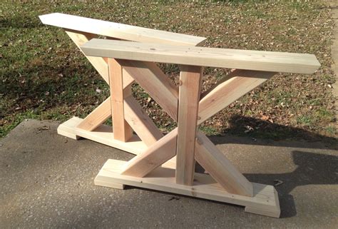 You just need to line up the flanges (disks) on the bottom side of your bench and drill screws into the holes. Farmhouse Trestle Table Legs X-Frame Table Legs Wood Table