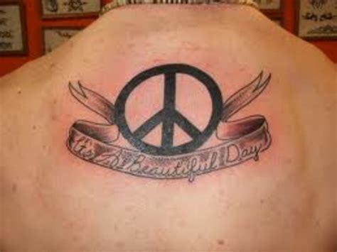 The dove symbolizes peace, love, and hope. Peace Sign Tattoo And Peace Sign Tattoo Meanings-Peace ...