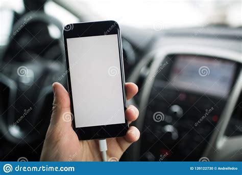 A unique and rare psd mockup of car dashboard to showcase your app designs. Close-up, Hand Of Man Holding Smartphone With Mockup On ...