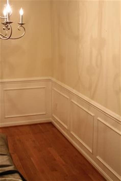 In this photo you can see the shadow boxes below the chair rail, partially covered up by the dining room chairs. chair rails and frames on the walls | Shadow Box - Chair ...