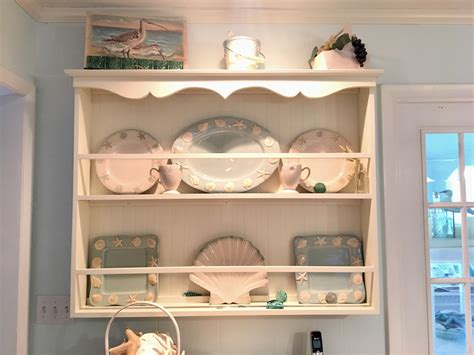 My shelf uses magnetic locks to keep it closed, and as easy as it seems to open, for anyone who doesn't understand how it works, it's deceptively difficult to open, even for adults. Plate Rack Beach Decor | Decor, Home decor, Plate racks