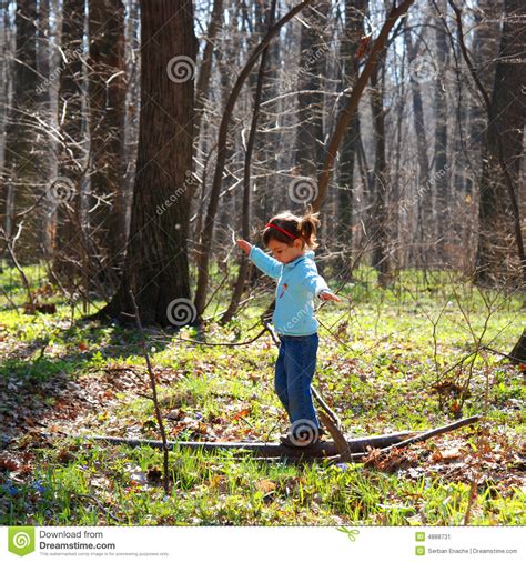 When i dig, i dig very shallow and wide. Little Girl Playing In Woods Stock Image - Image: 4888731