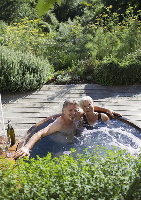 You could even dig a hole in the ground to build a temporary hot tub right in the sand (or in the snow) by securing the hammock within the hole. Senior couple relaxing in hot tub on patio - Stock Image - F032/2556 - Science Photo Library