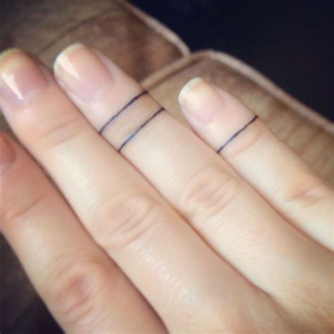 Super thin line band tattoo around the forearm. simple line circle/ring tattoos around the fingers ...